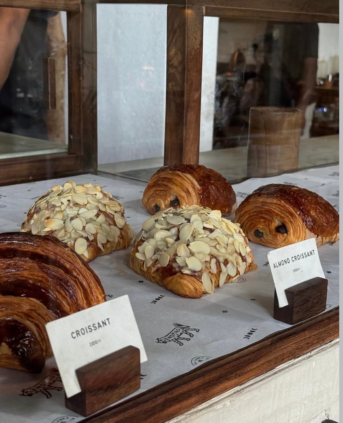 Almond croissants and pain au chocolat in the bakery counter