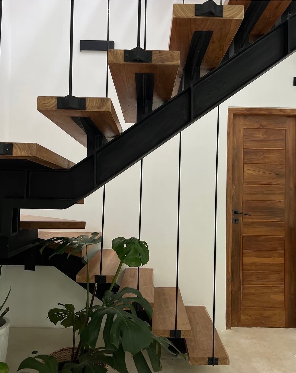 Floating wooden staircase inside the villa
