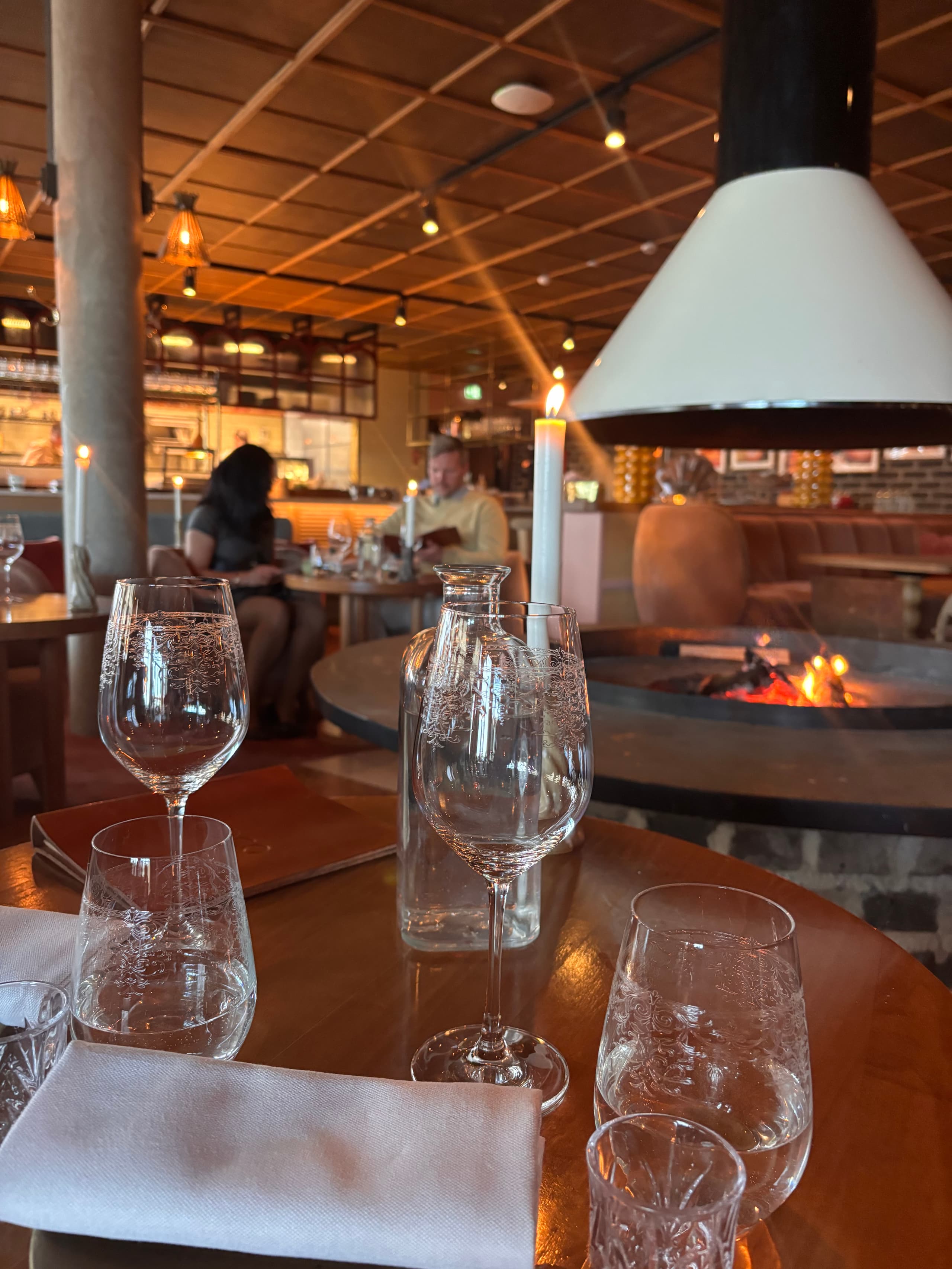 Table set by the open fireplace in the restaurant